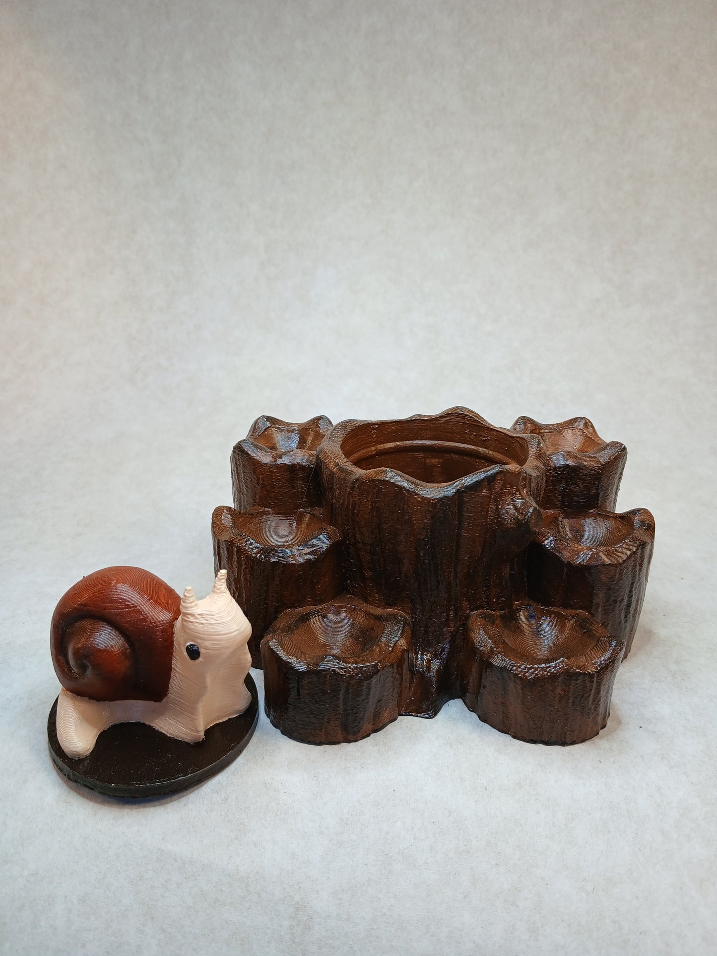 Dice guard and storage Snail on stump.