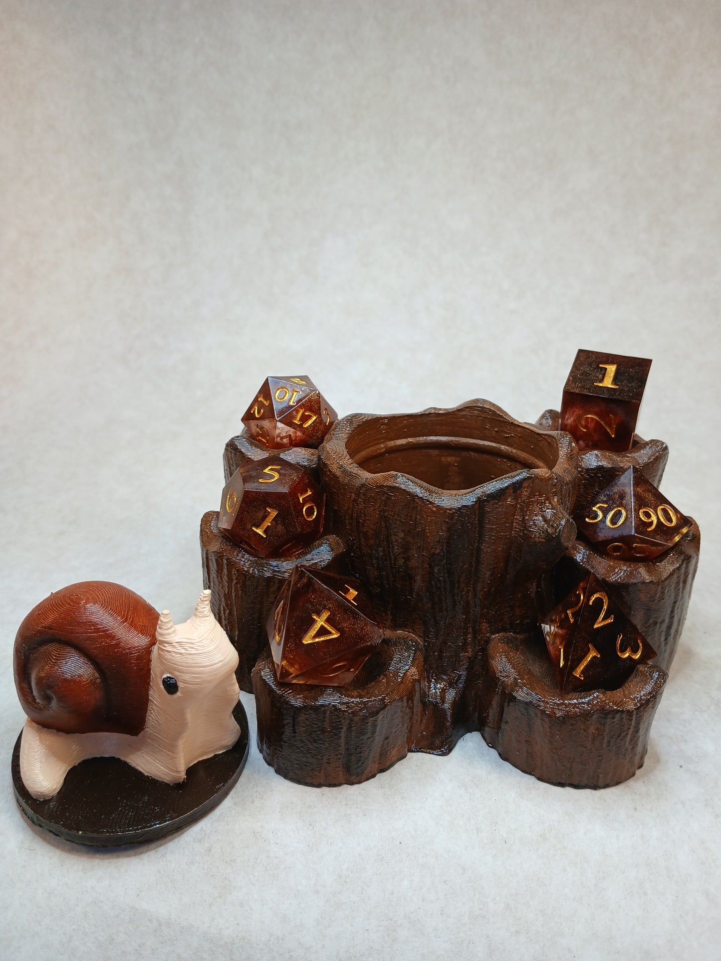 Dice guard and storage Snail on stump.